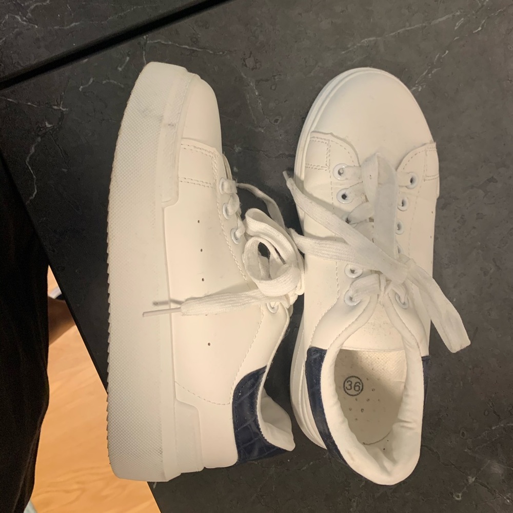 White sneakers black heel